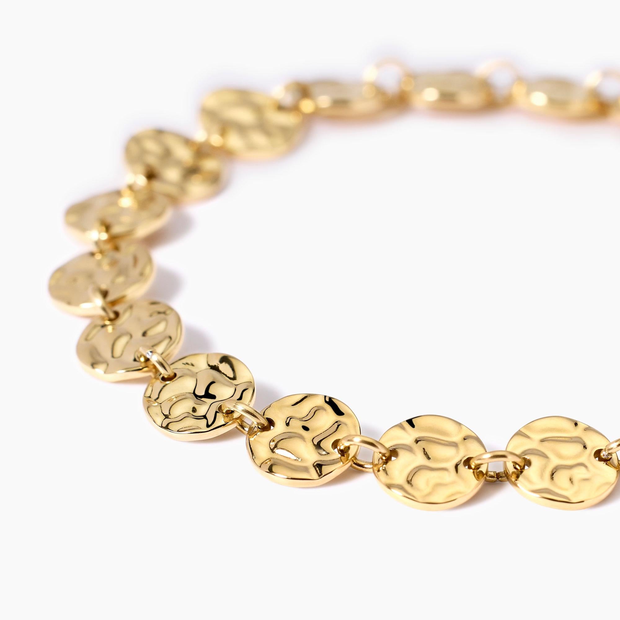 Bracciale dorato con tondi effetto martellato