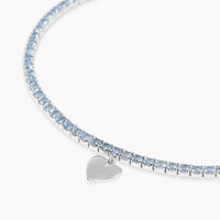 Bracciale tennis con acquamarina sintetica e ciondolo cuore