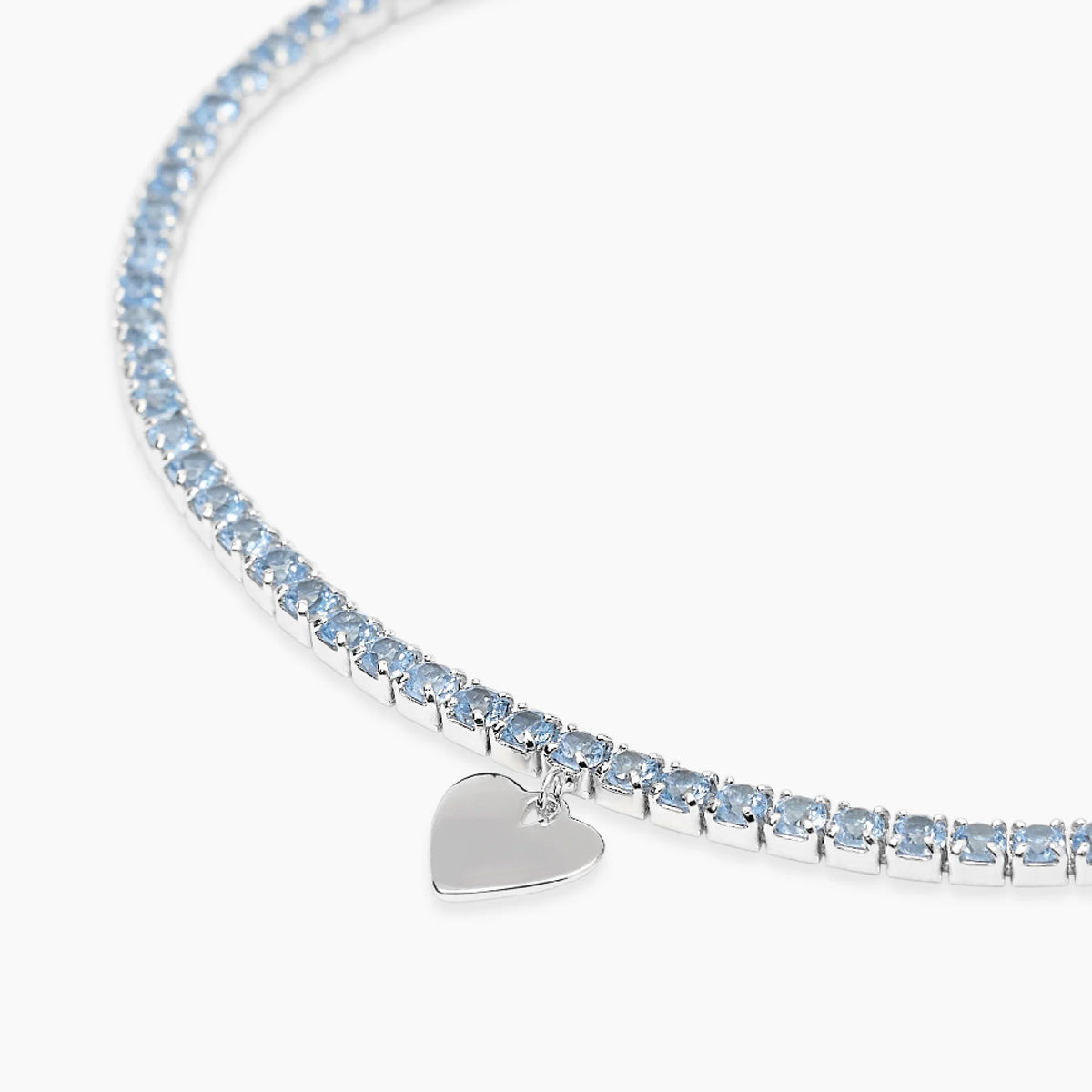 Bracciale tennis con acquamarina sintetica e ciondolo cuore